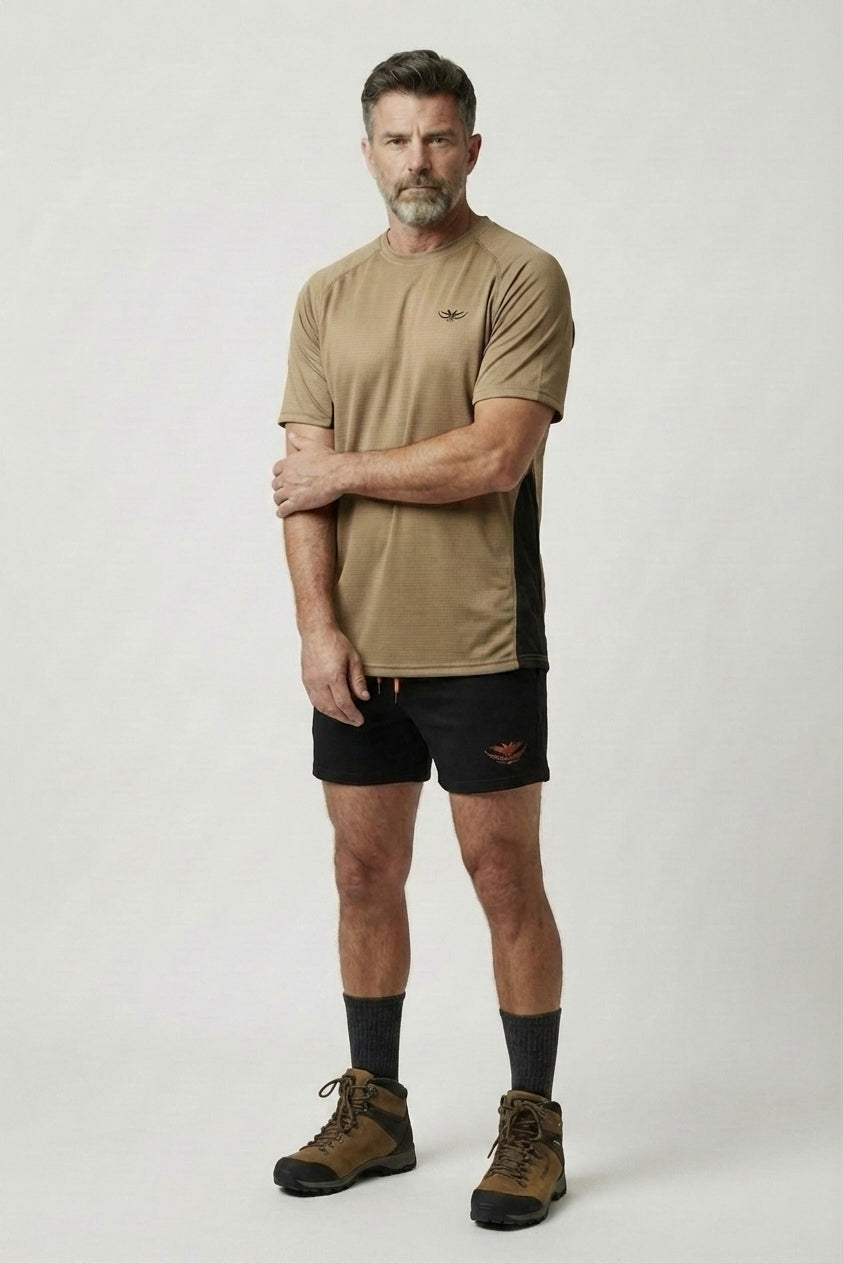 Game Gear Turf Shorts on model — arms crossed