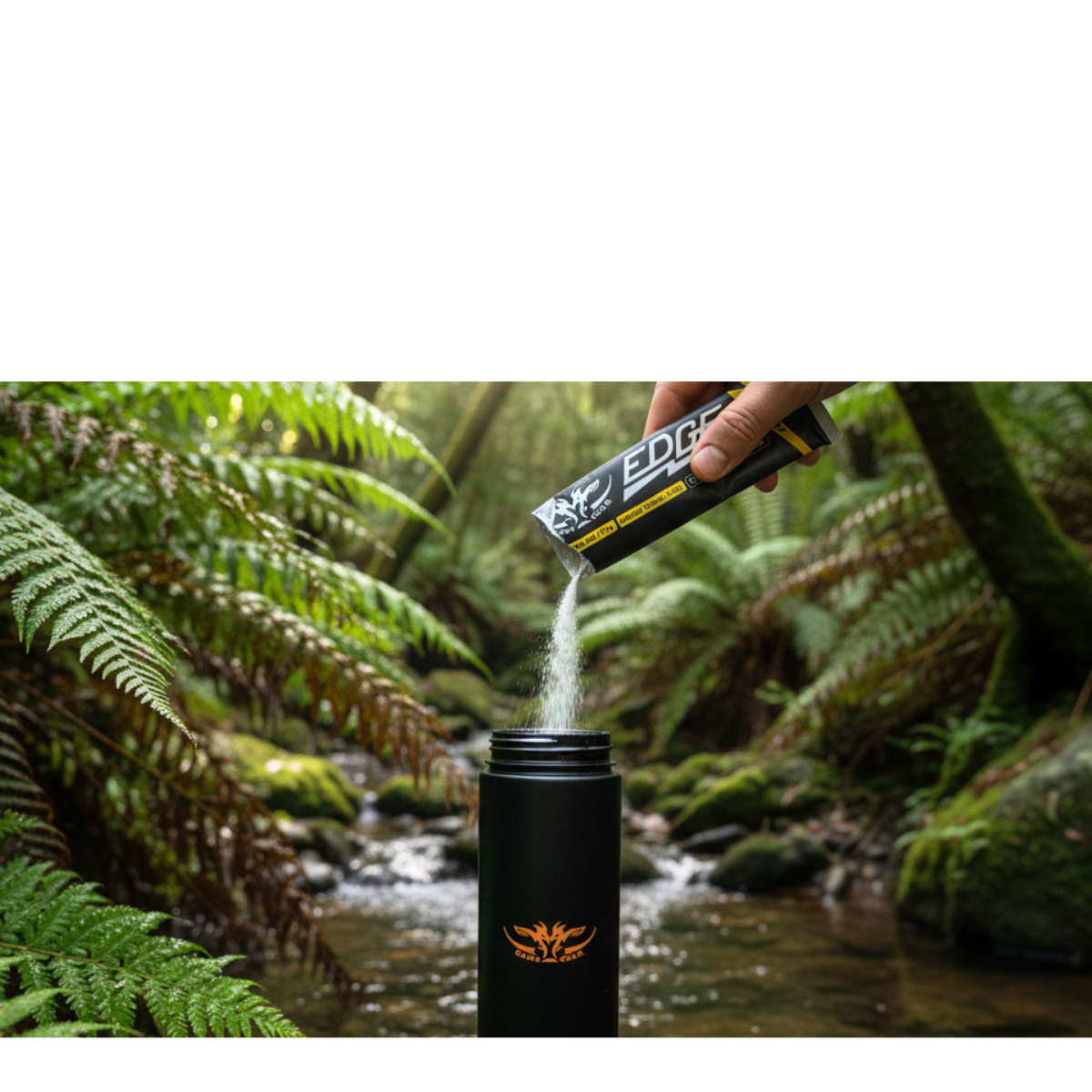 hand holding game gear edge hydration powder sachet pouring into drink bottle