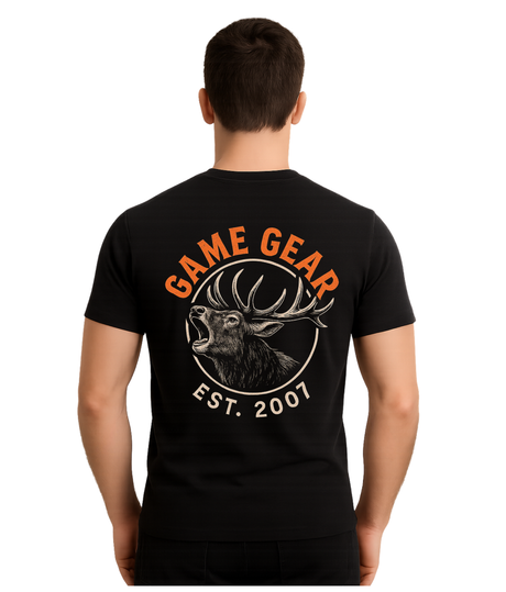 Person wearing a black t-shirt with 'Game Gear' and deer design on the back